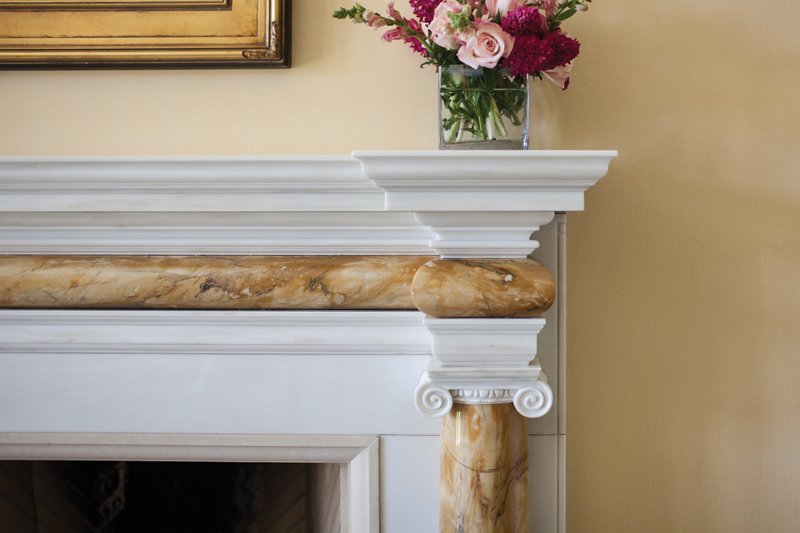 The architect-designed dining room mantel was hand-carved in Italy.
