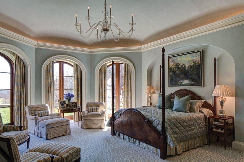 The octagonal master bedroom in aqua Venetian plaster provides a cozy retreat with expansive southern views.