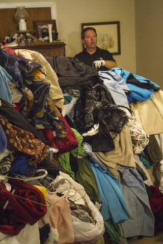 Photo courtesy of American Public Television  Matt Paxton sorting through piles of clutter on Hoarders.