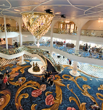 Start your cruise on the Disney Wish in the elegant grand lobby.